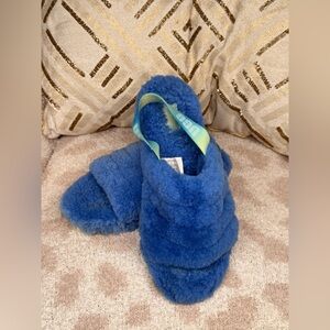UGG Fluff Yeah slides in blue sheepskin with an elastic heel strap